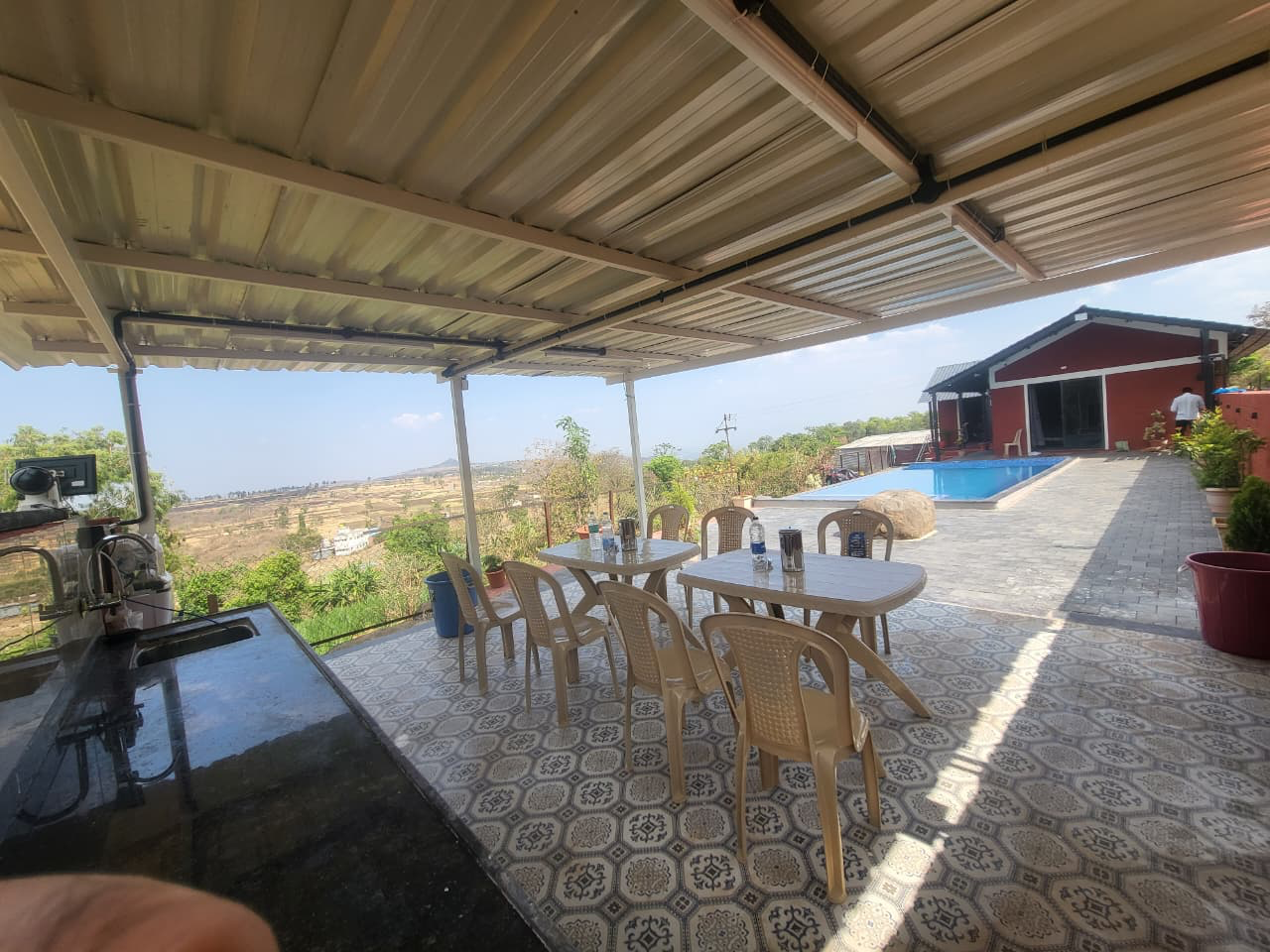 Outdoor dining and kitchen area overlooking the valley at V-Farms