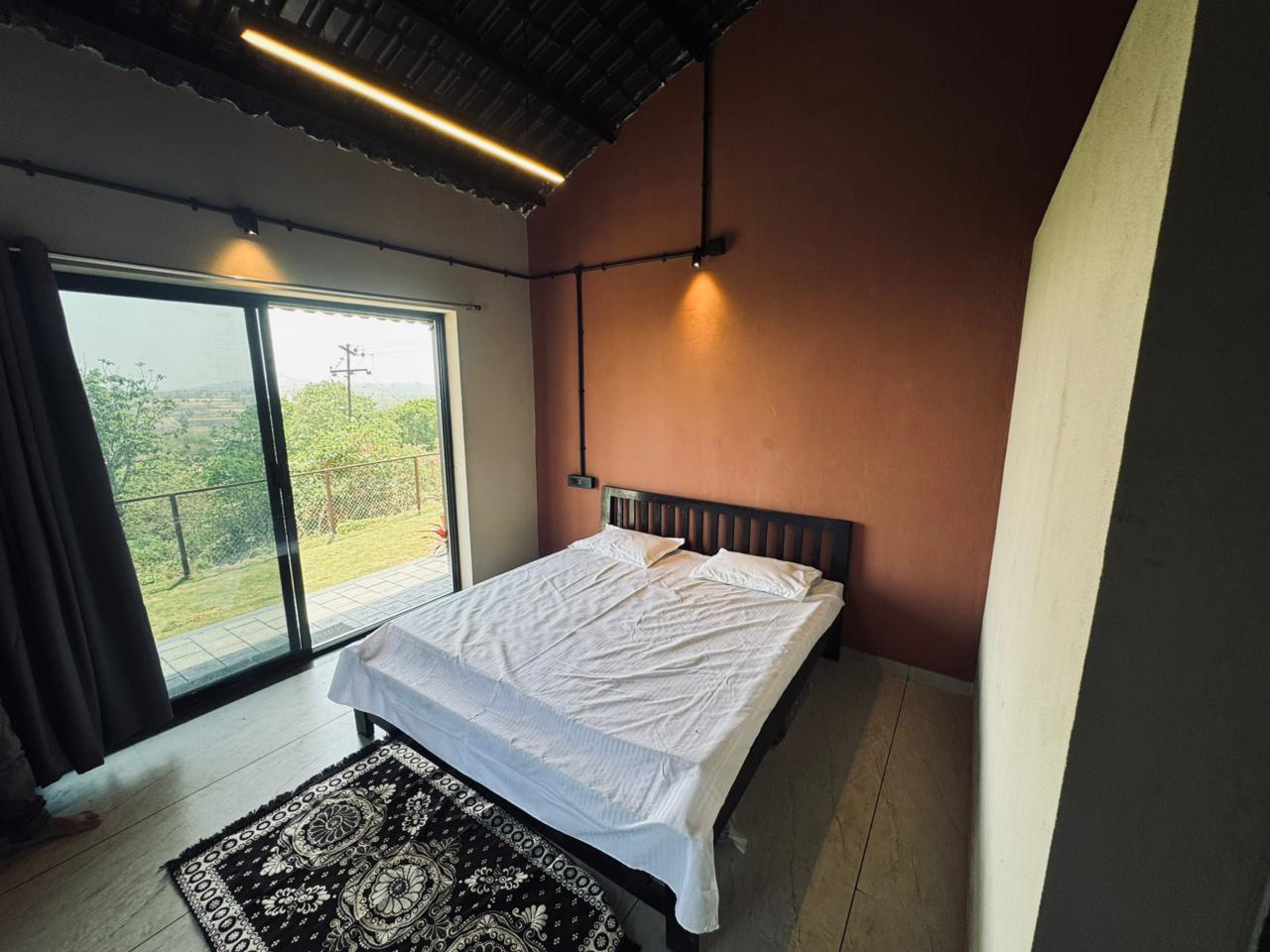 Premium bedroom at V-Farms with valley-facing sliding doors