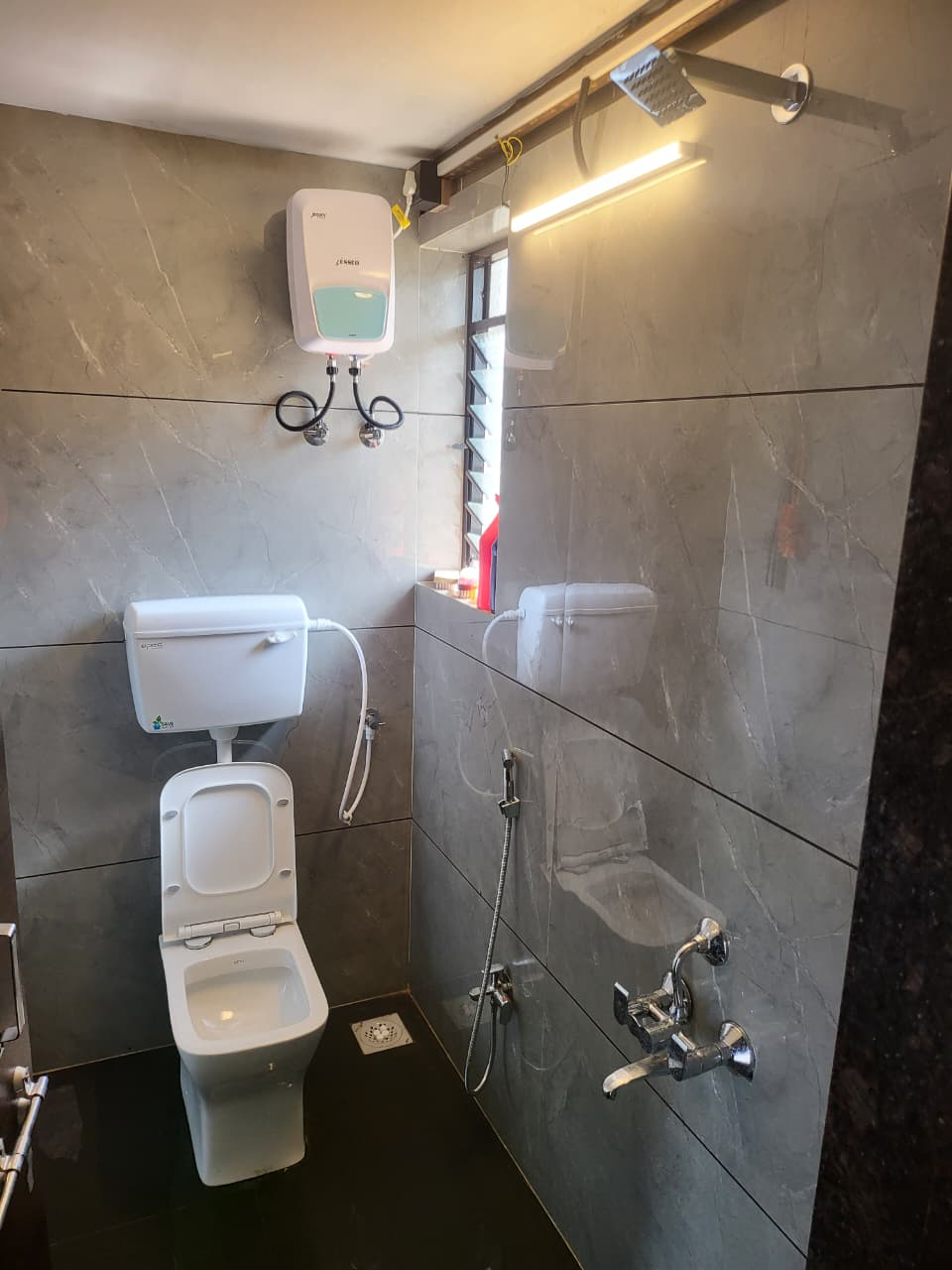 Clean premium bathroom with hot water facility at V-Farms